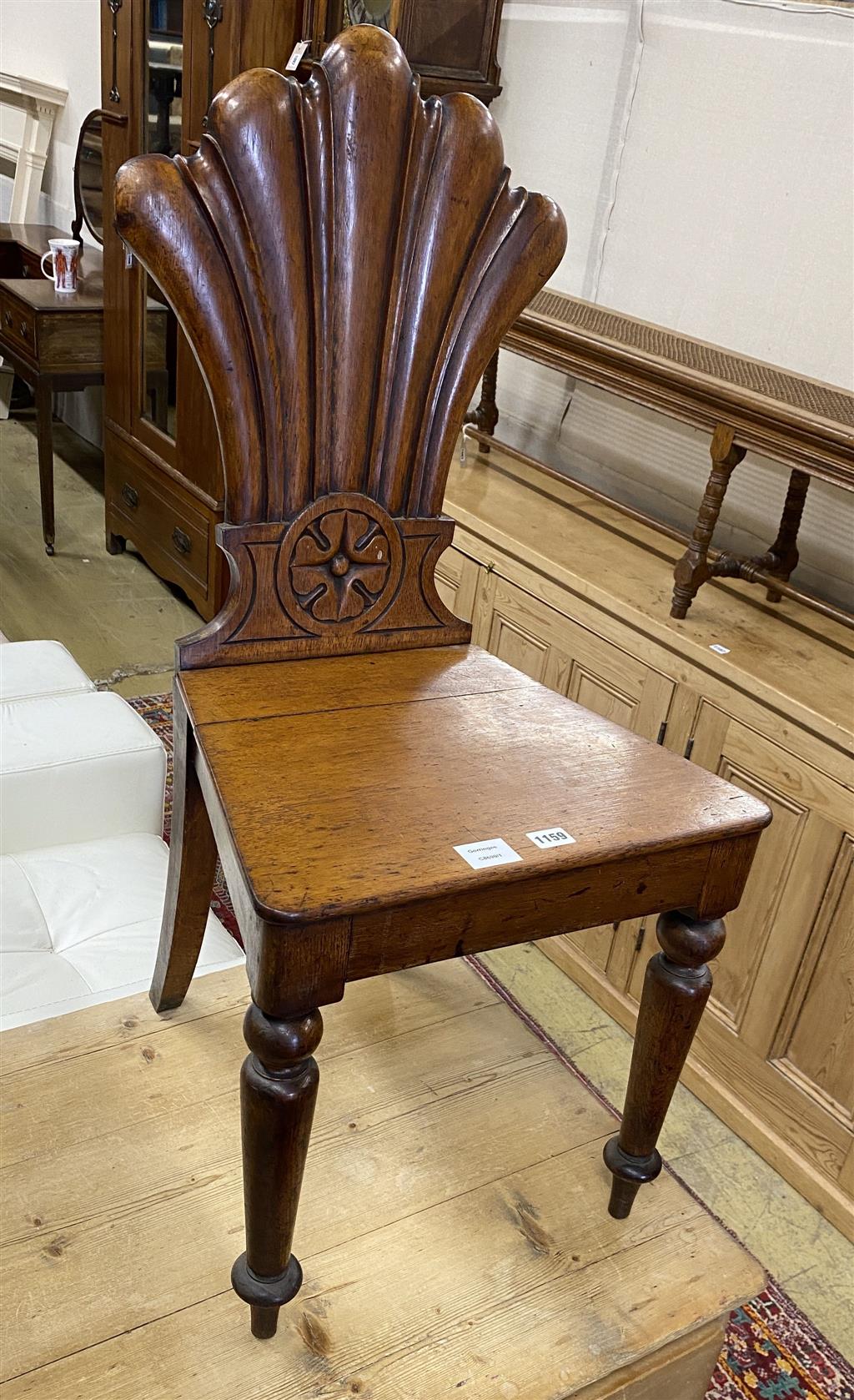 A Victorian oak hall chair